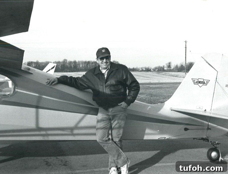 My Dad standing beside an airplane similar to the one we flew from Vermont to Ohio.