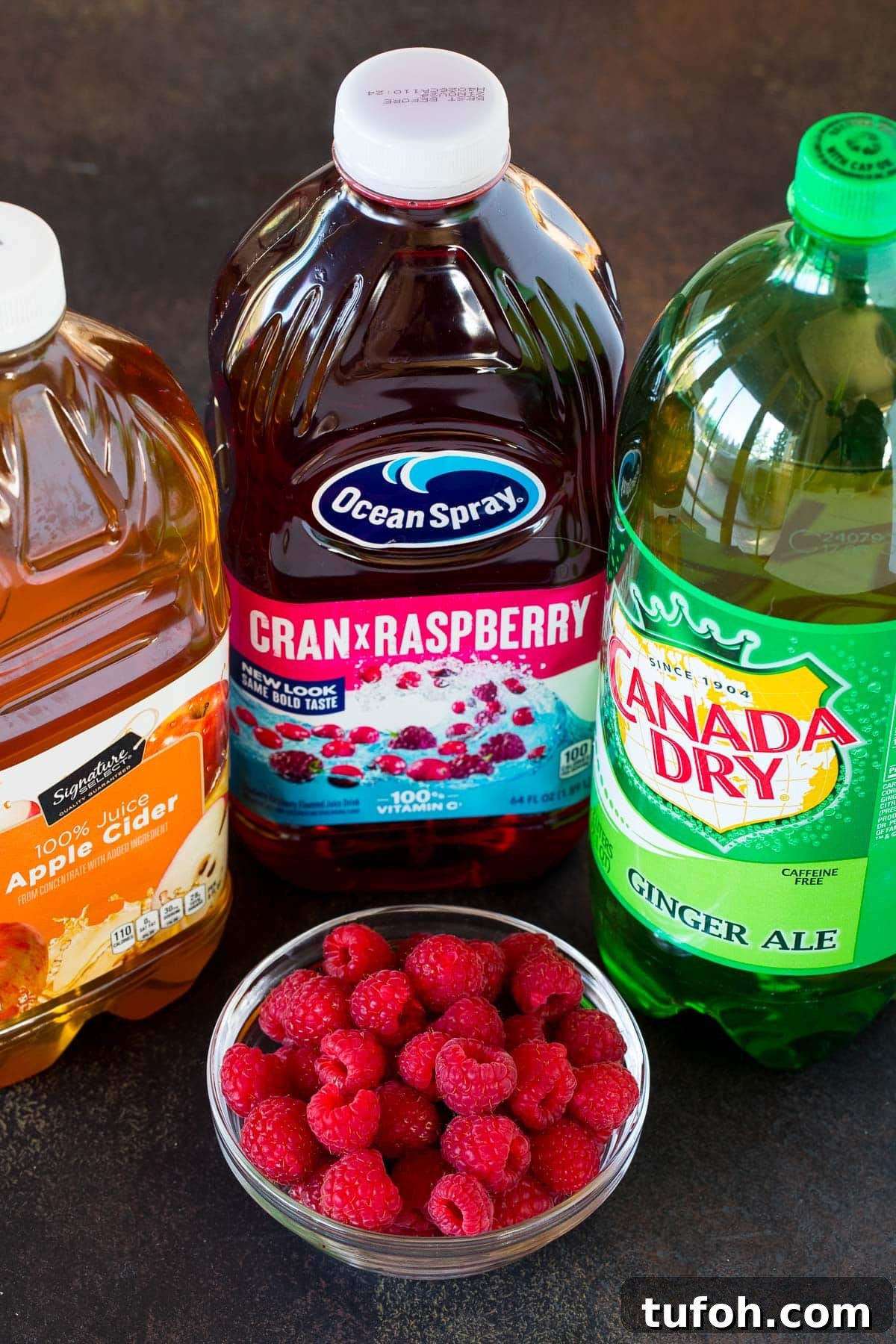 Bottles of ginger ale, cranberry raspberry juice and apple cider.