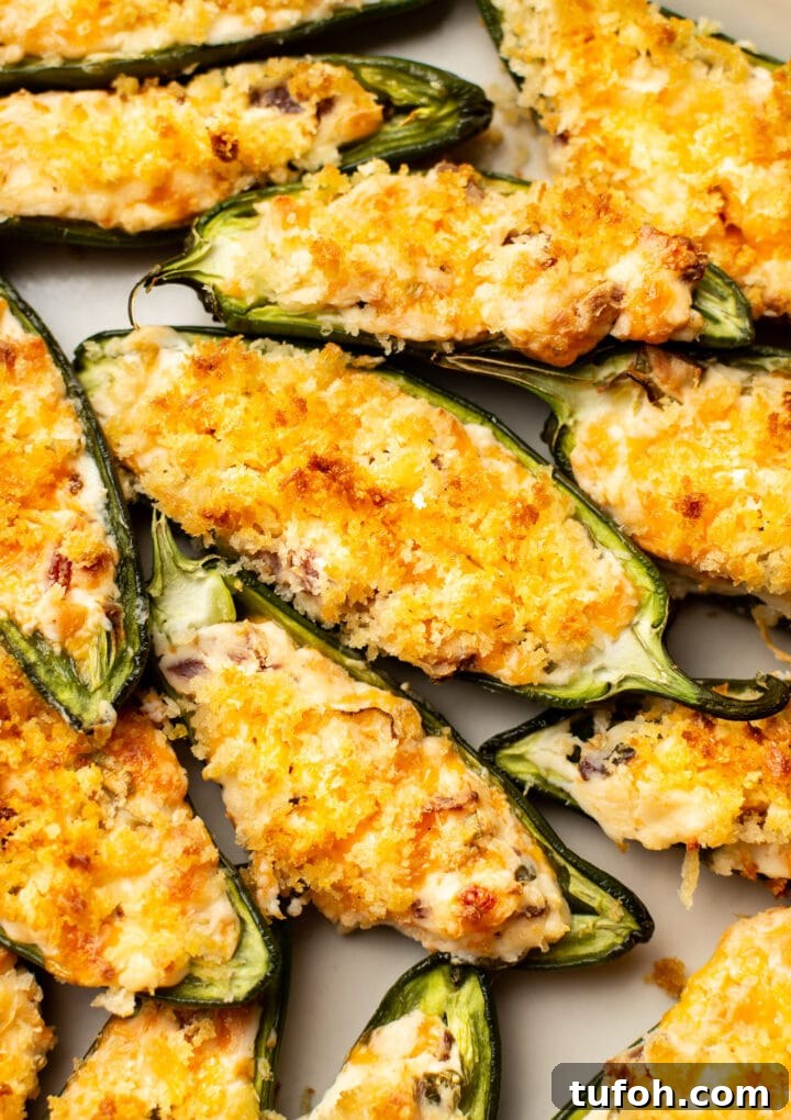 Crispy Jalapeño Poppers with Cheesy Bacon Filling 2 closeup of several jalapeno poppers