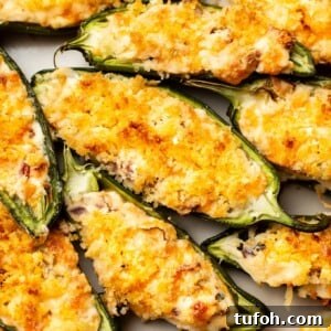 Crispy Jalapeño Poppers with Cheesy Bacon Filling 8 closeup of several jalapeno poppers