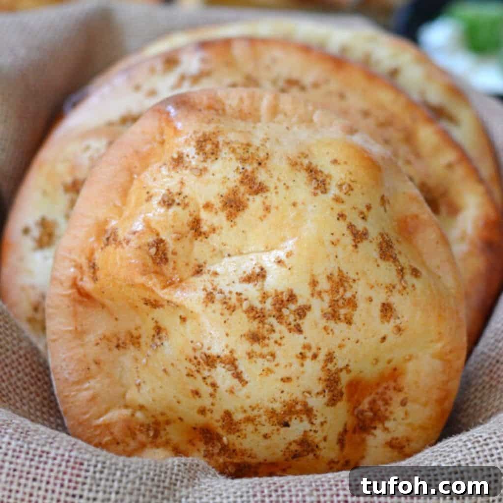 Khameer flat bread stacked on a burlap fabric