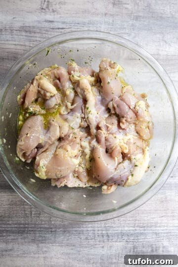 Crispy Grilled Lemon-Pepper Chicken Thighs with Zesty Marinade 5 marinated chicken thighs