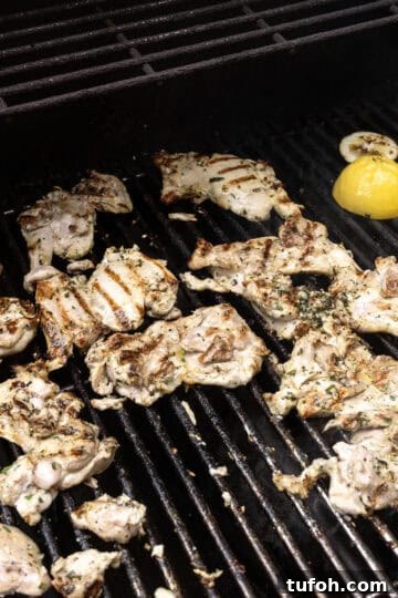 Crispy Grilled Lemon-Pepper Chicken Thighs with Zesty Marinade 7 chicken thighs on the grill