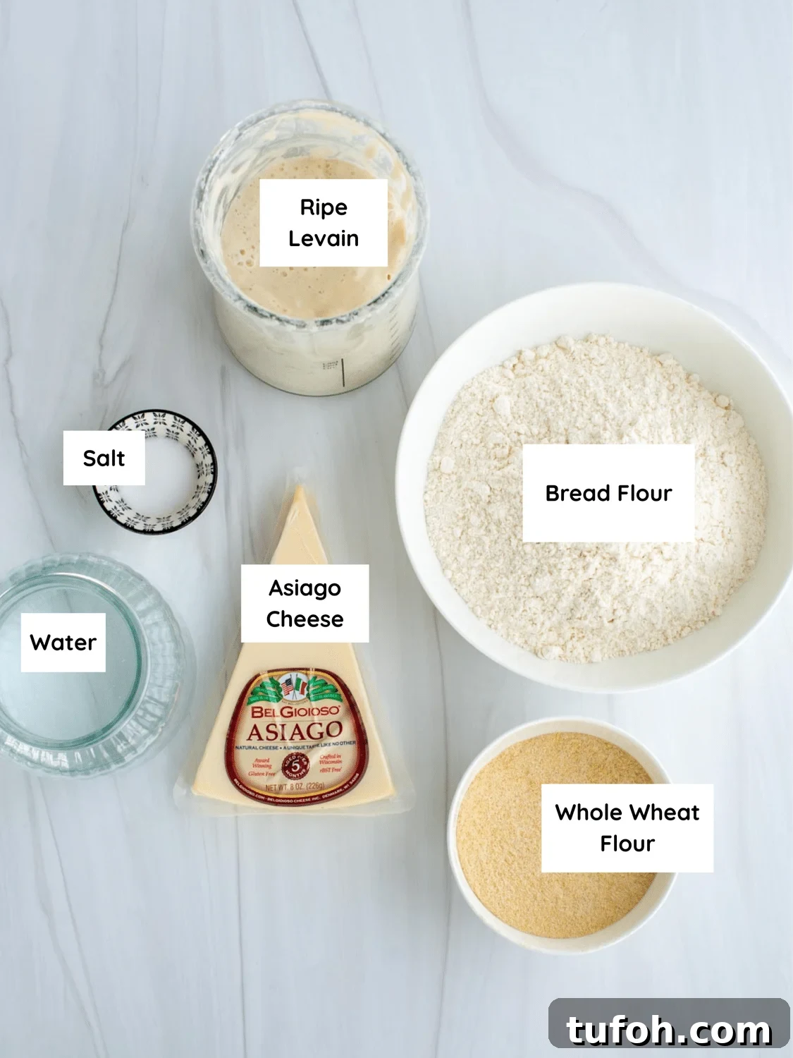 Asiago Sourdough Bagel Loaf Recipe: Chewy Crust, Tangy Interior 3 Ingredients for sourdough asiago bagel bread labeled on a countertop.