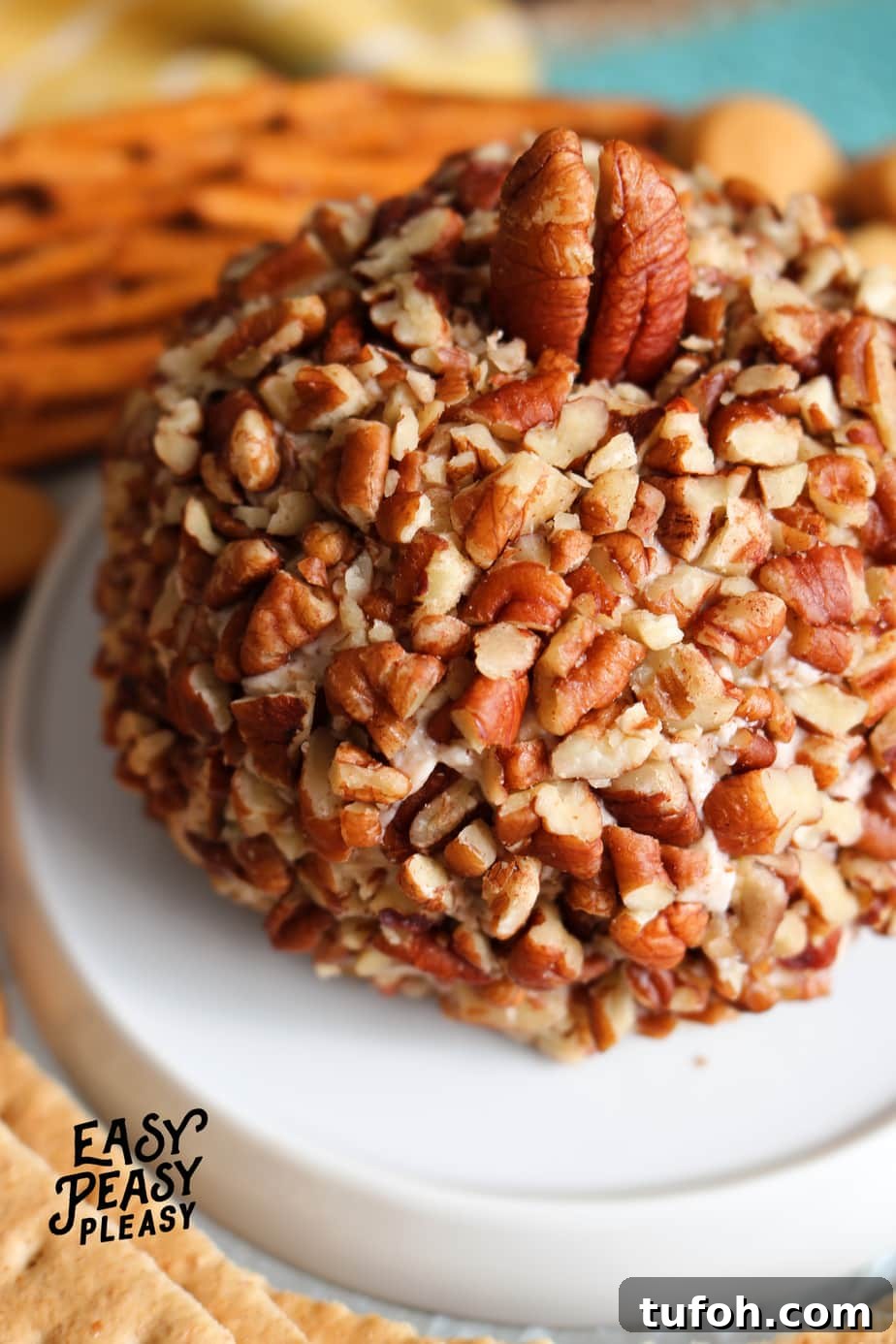 Pumpkin Spice Cheese Ball is the perfect appetizer for the Holidays. It's only 4 ingredients, freezer friendly, and perfect to make ahead.