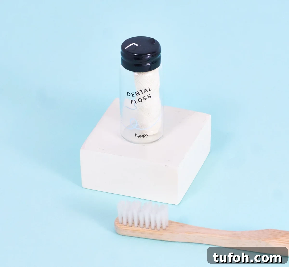 Non-Toxic Natural Dental Floss Without PFAS — Top Picks 7 container of floss and a toothbrush