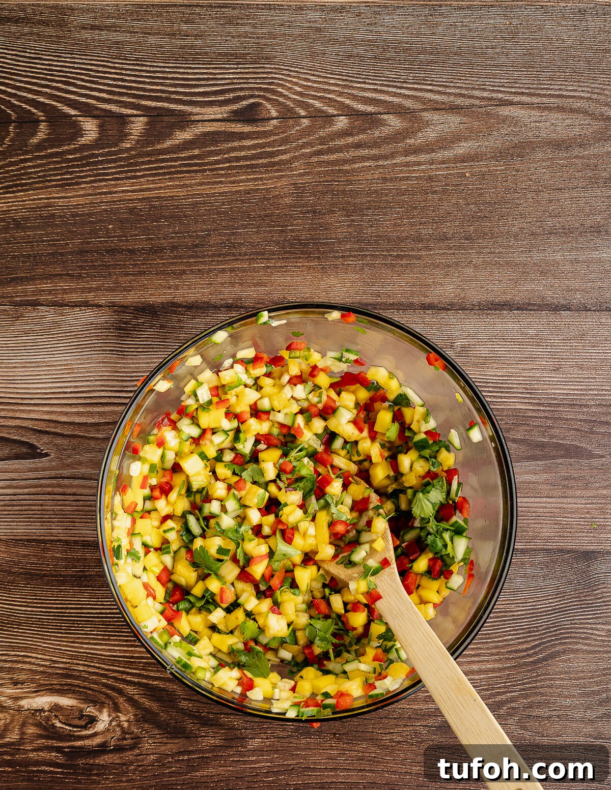 Tangy Pineapple Mango Salsa Recipe for Grilled Fish & Tacos 12 a large bowl of pineapple mango salsa.
