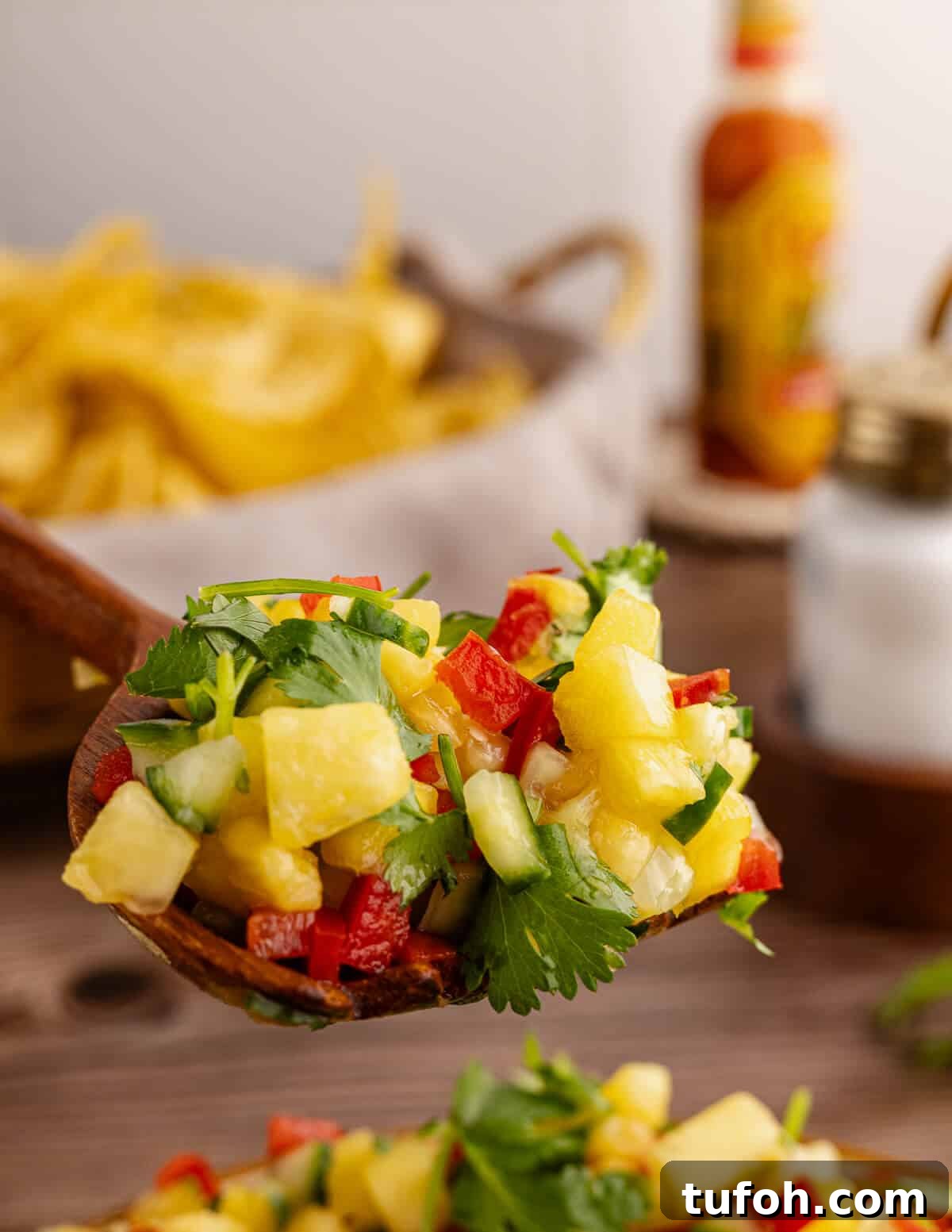 Tangy Pineapple Mango Salsa Recipe for Grilled Fish & Tacos 4 a spoonful of pineapple mango salsa.