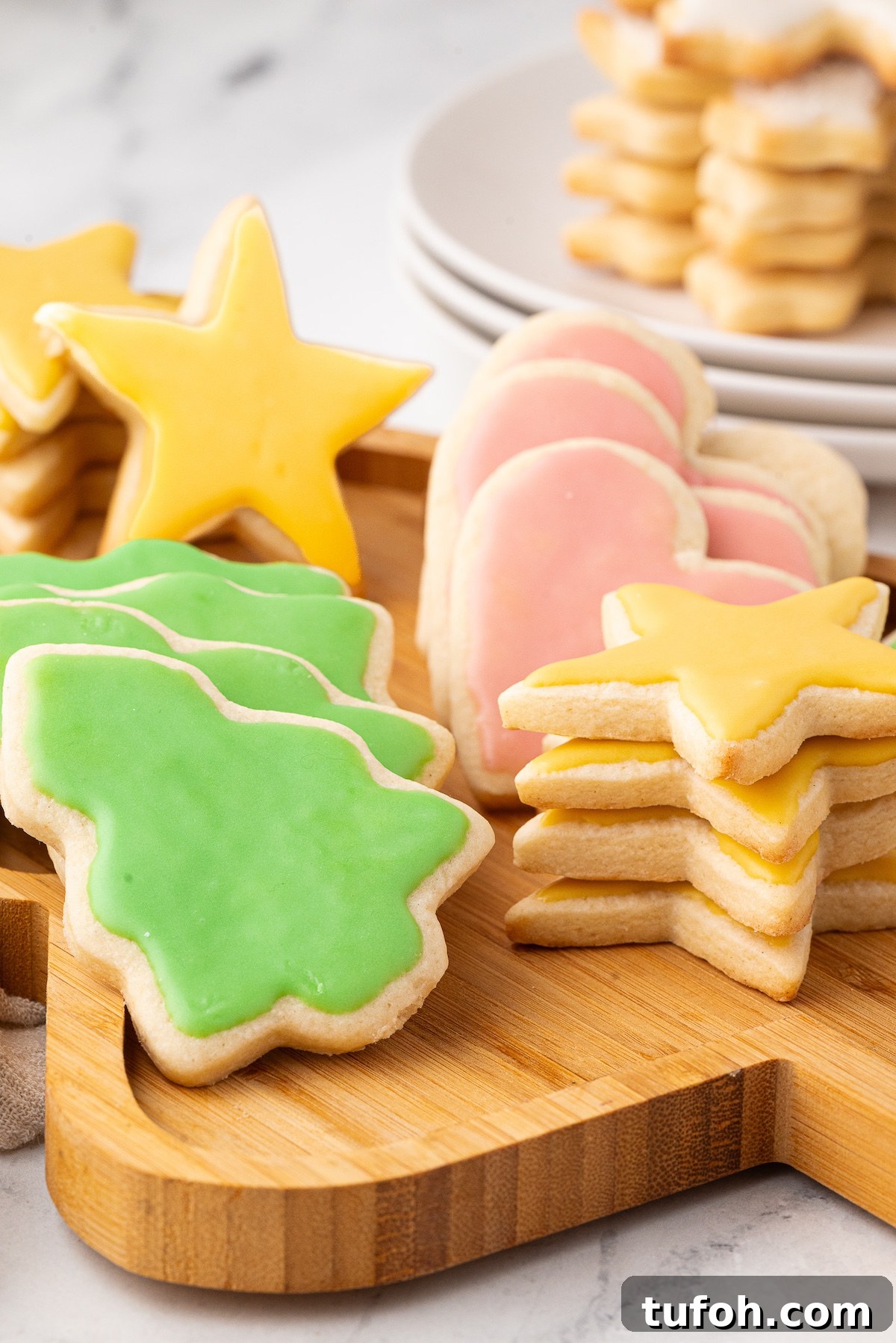 Soft Cut-Out Sugar Cookies Recipe for Tender, Perfect Shapes 4 Decorated thick and soft cut out sugar cookies - christmas tree, stars and hearts.