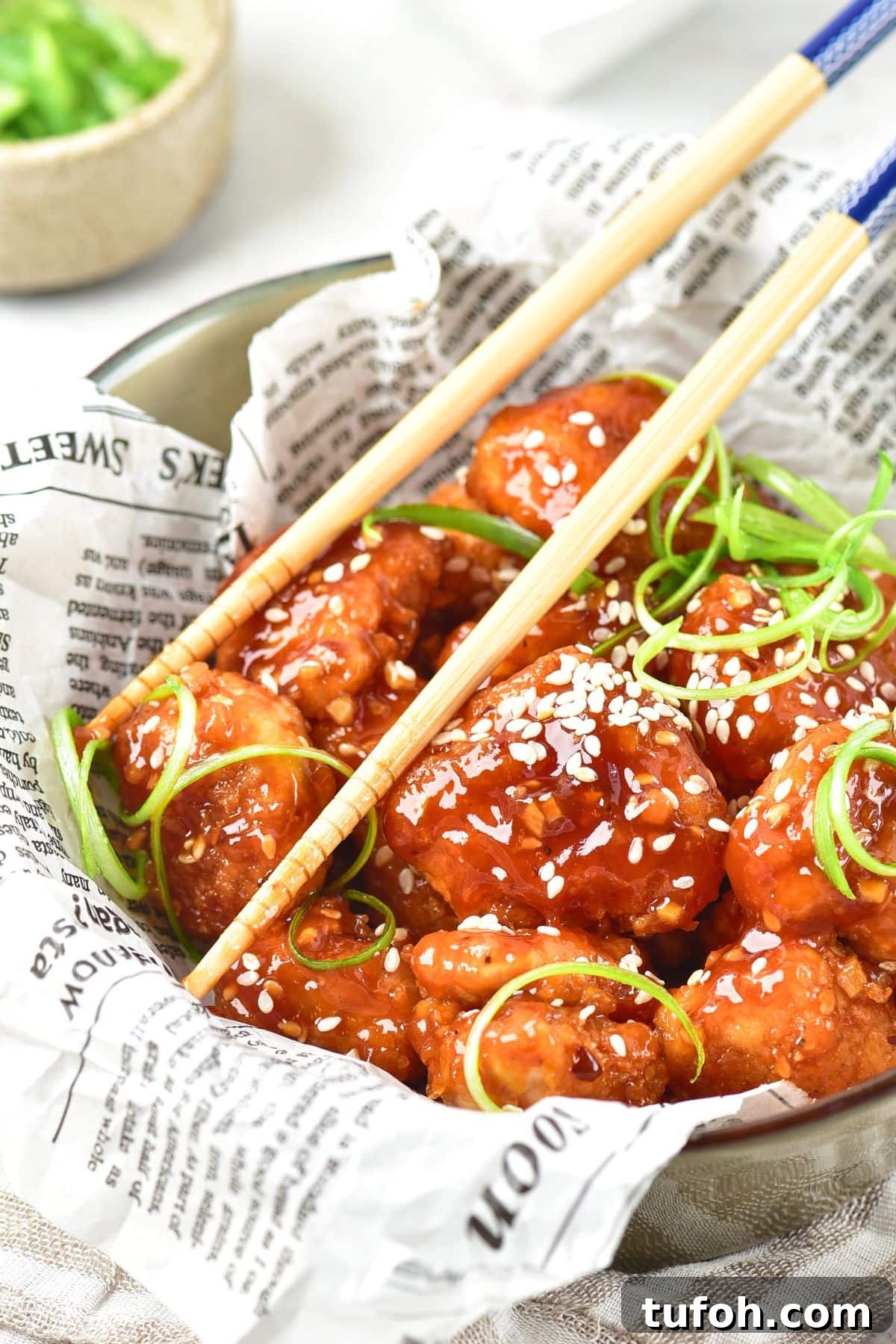 Gluten-Free Korean Fried Chicken Recipe Chopsticks in bowl of gluten-free korean fried chicken