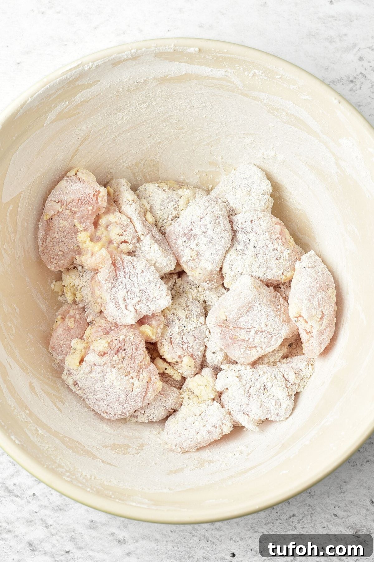 Gluten Dairy-Free Korean fried chicken A bowl of cornstarch coated chicken pieces