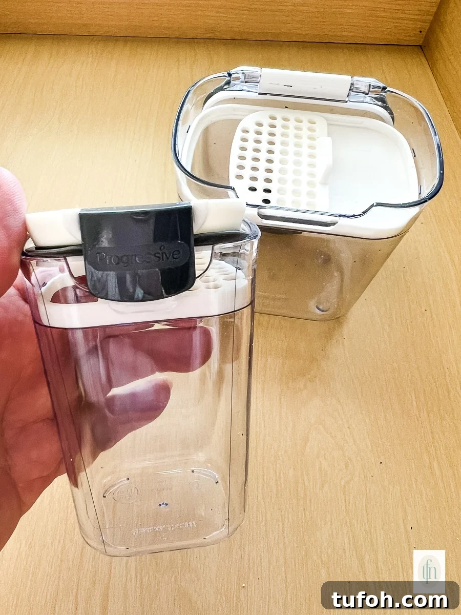 Empty plastic container with small holes on top for shaking.