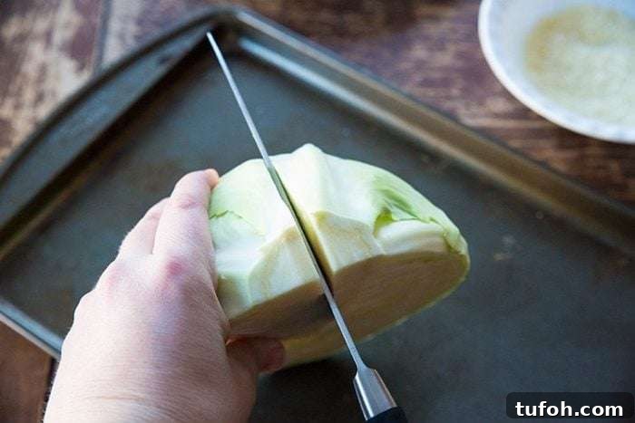Cut each half of cabbage in half again. Cut each half of cabbage in half again.