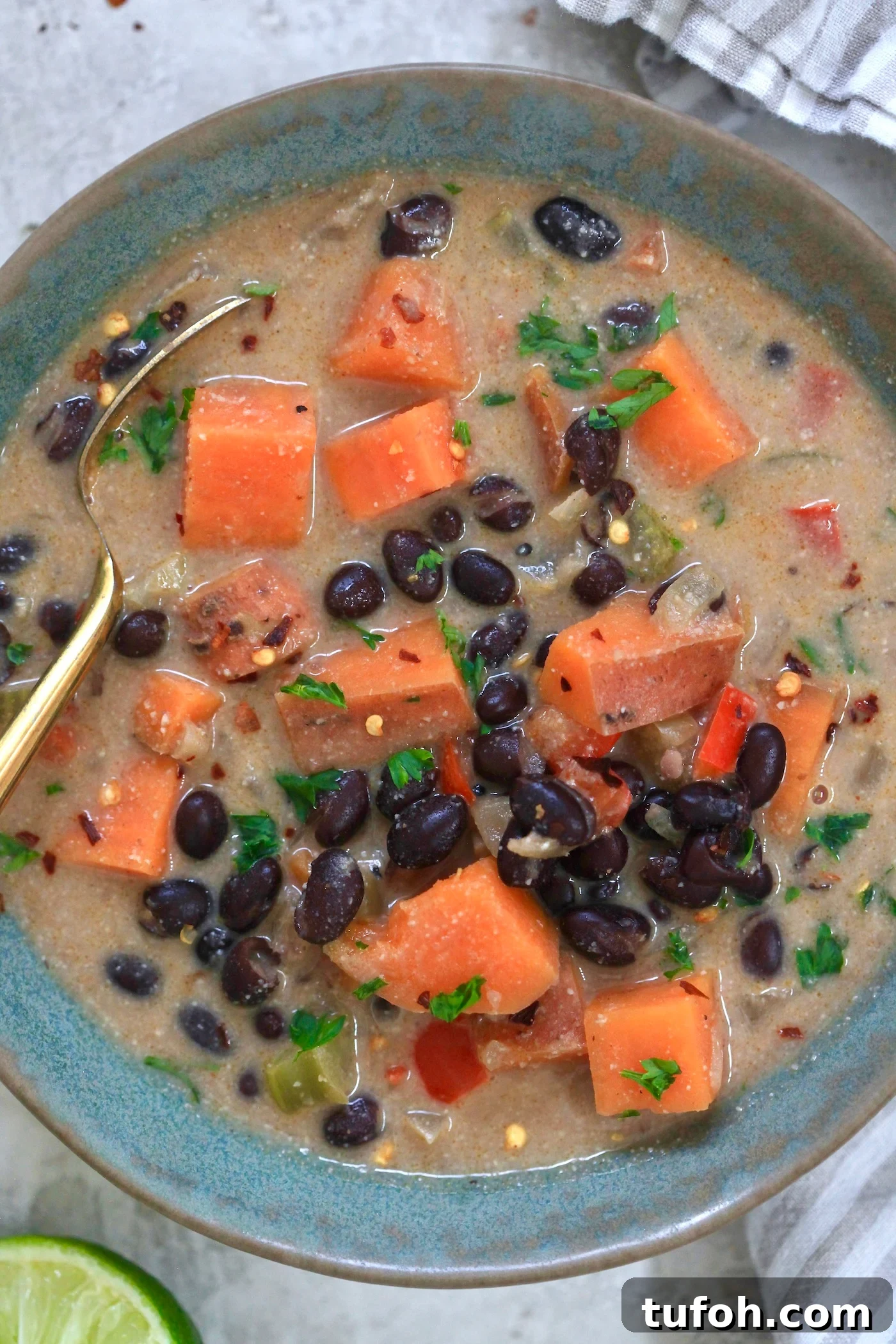 Creamy Dairy-Free Sweet Potato and Black Bean Soup Recipe 7 up close blue bowl of sweet potato soup