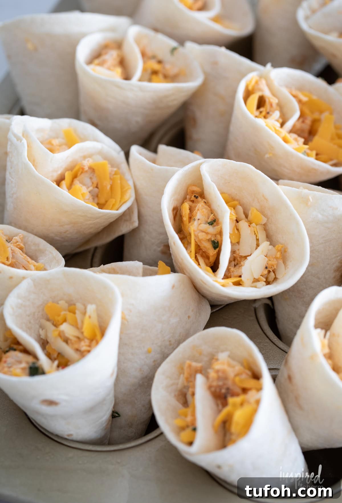 Cheesy Quesadilla Dipper Recipe: Crispy, Gooey Snack Idea 8 Cheesy Quesadilla Dipper unbaked in a muffin tin.