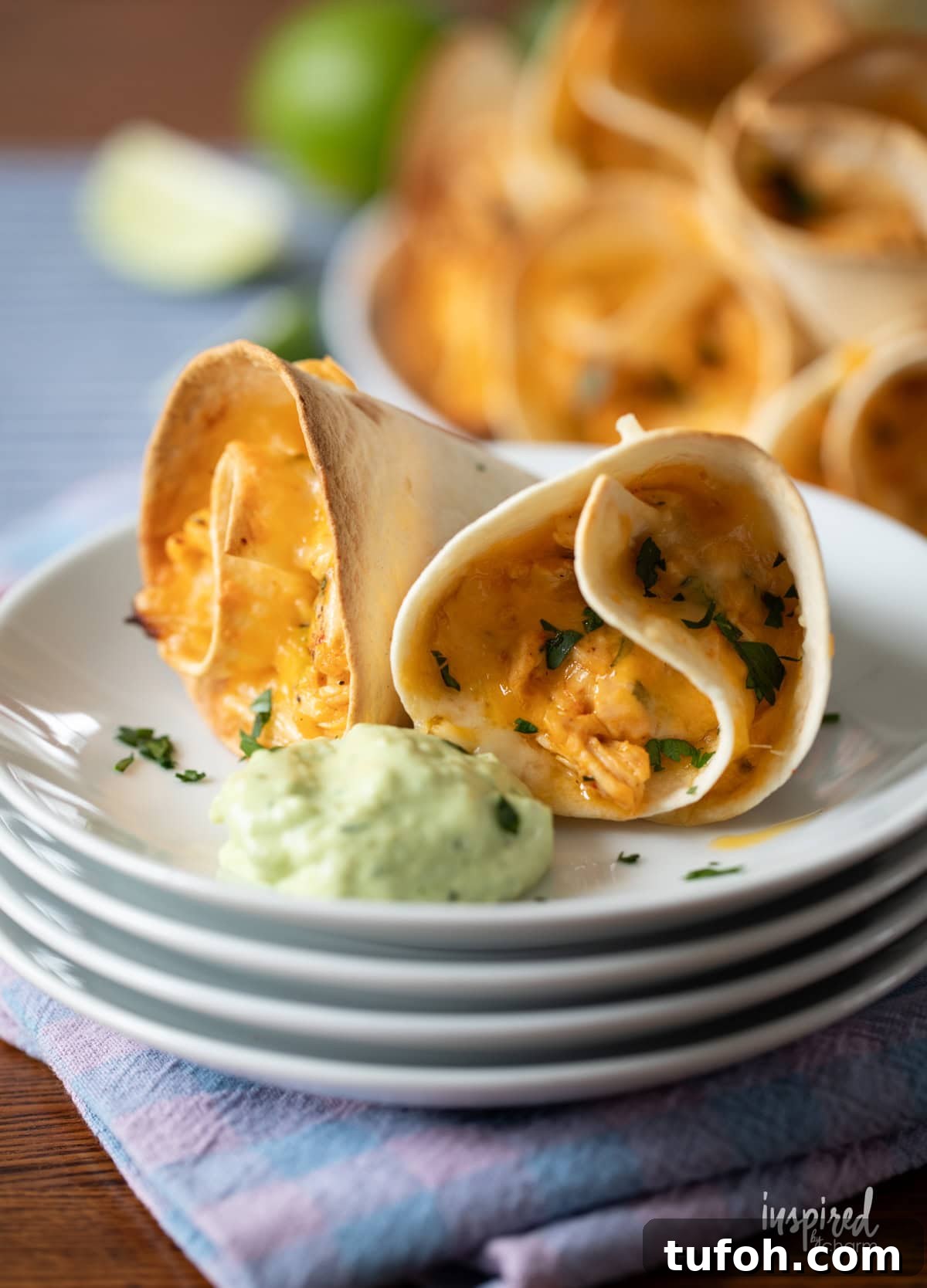 Cheesy Quesadilla Dipper Recipe: Crispy, Gooey Snack Idea 3 two Cheesy Quesadilla Dippers on a plate with avocado dipping sauce.