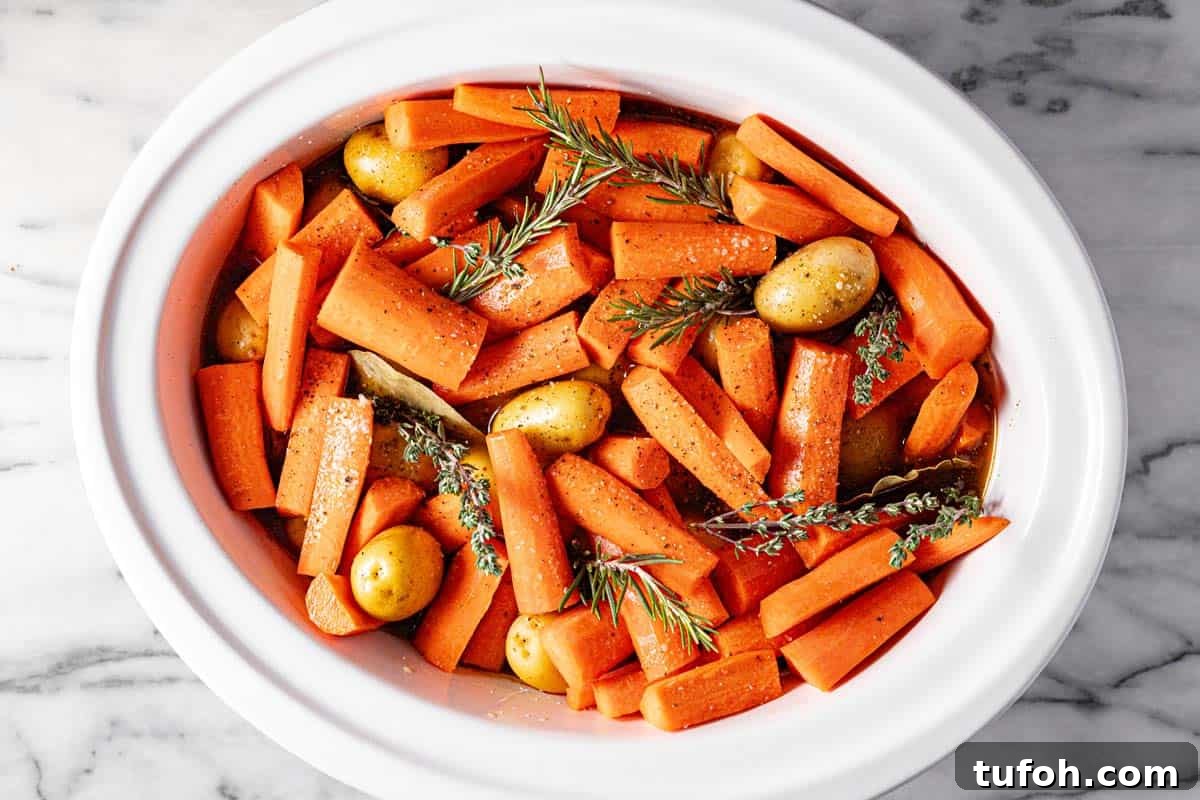 Slow-Cooker Pot Roast with Rich Homemade Gravy 6 Large crock pot insert filled with ingredients to make slow cooker pot roast.