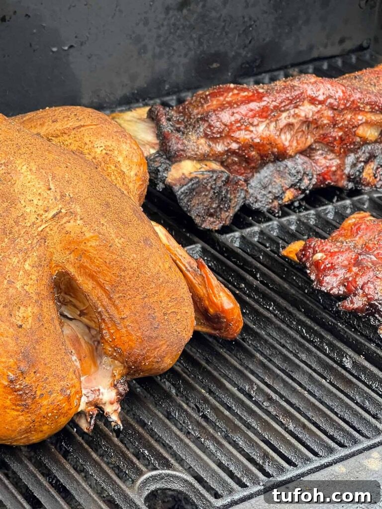 Perfect Whole Smoked Turkey: Year-Round Smoking Guide 8 A turkey and beef ribs on a smoker.