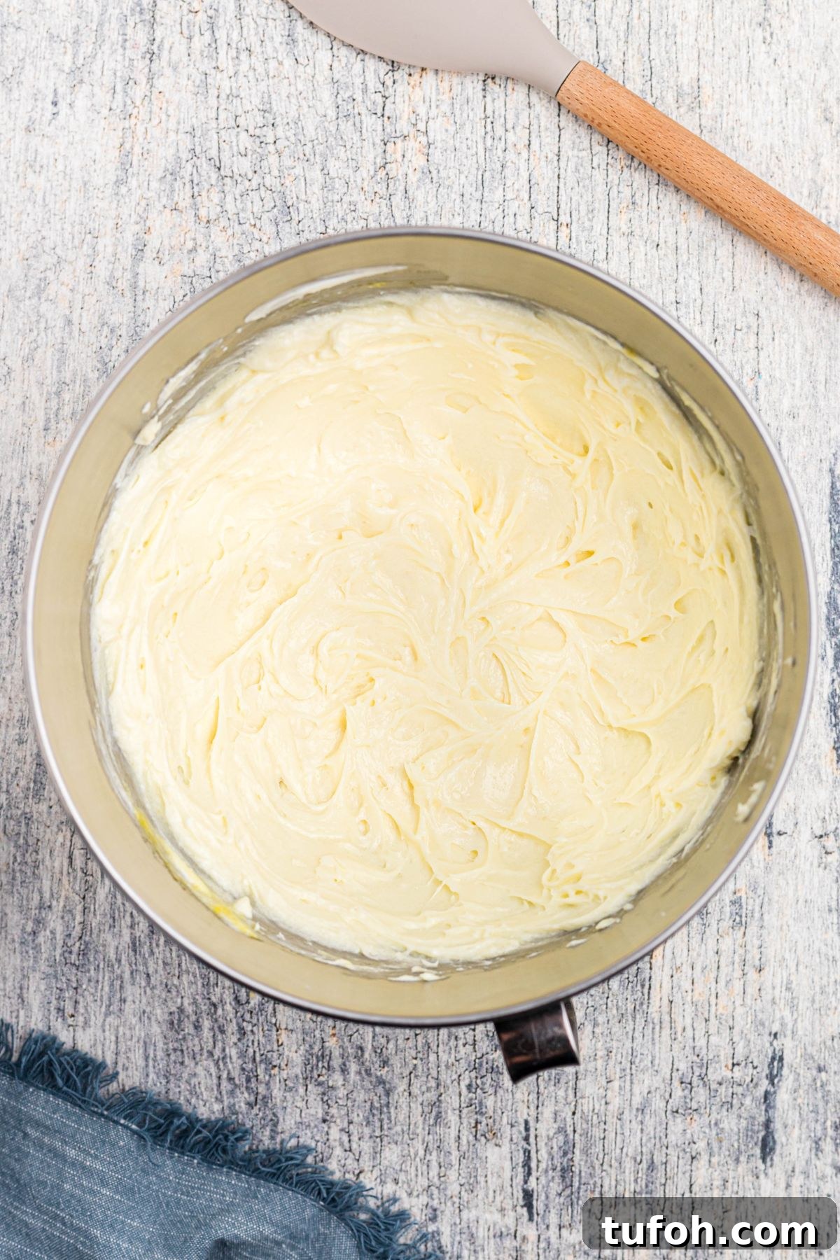 Churro Cheesecake Recipe: Cinnamon-Sugar Cheesecake Bars 6 Cream cheese and sugar mixture in a large mixing bowl.