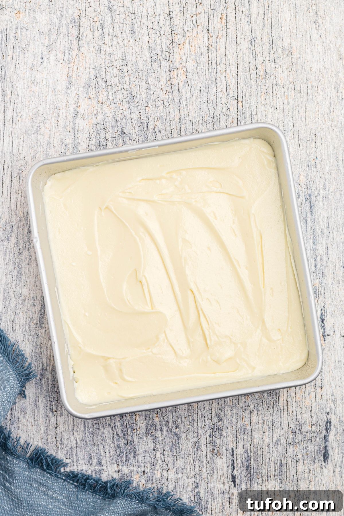 Churro Cheesecake Recipe: Cinnamon-Sugar Cheesecake Bars 7 Cheesecake filling spread evenly in an 8x8 baking pan.