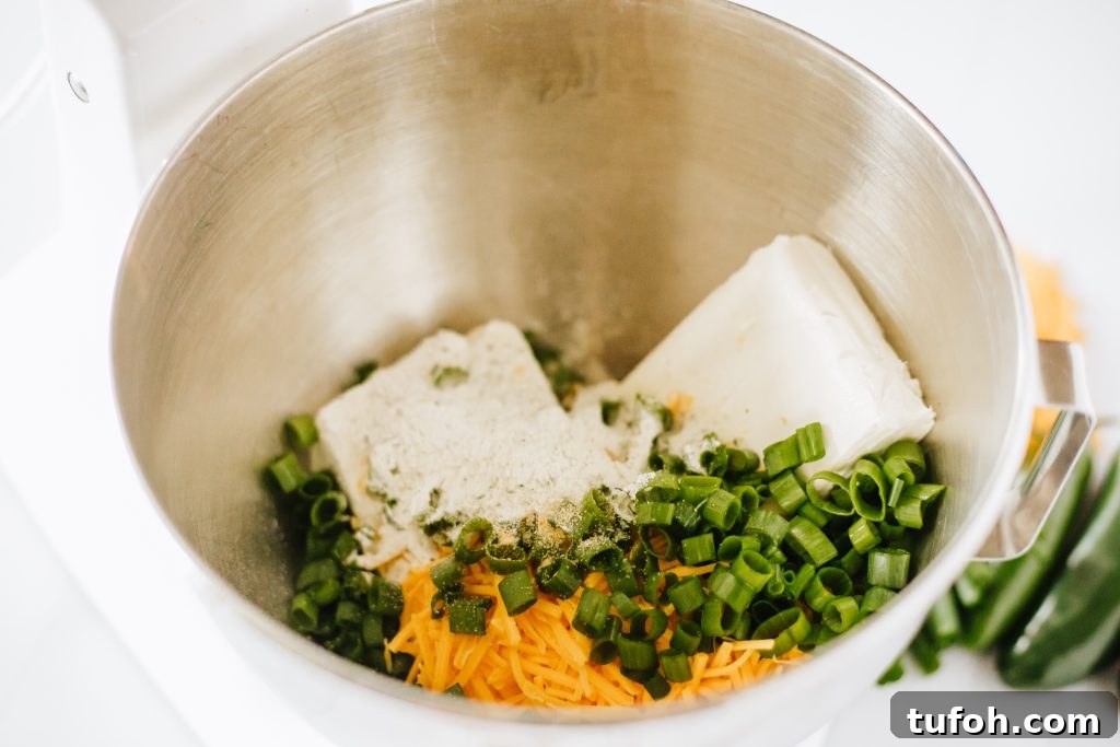 jalapeno popper filling ingredients in a metal mixing bowl