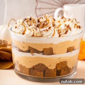 Garnished pumpkin trifle in a trifle dish.