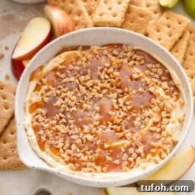 Close up of cream cheese caramel apple dip in a bowl.