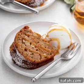 Plated slice of easy apple bundt cake topped with caramel sauce.