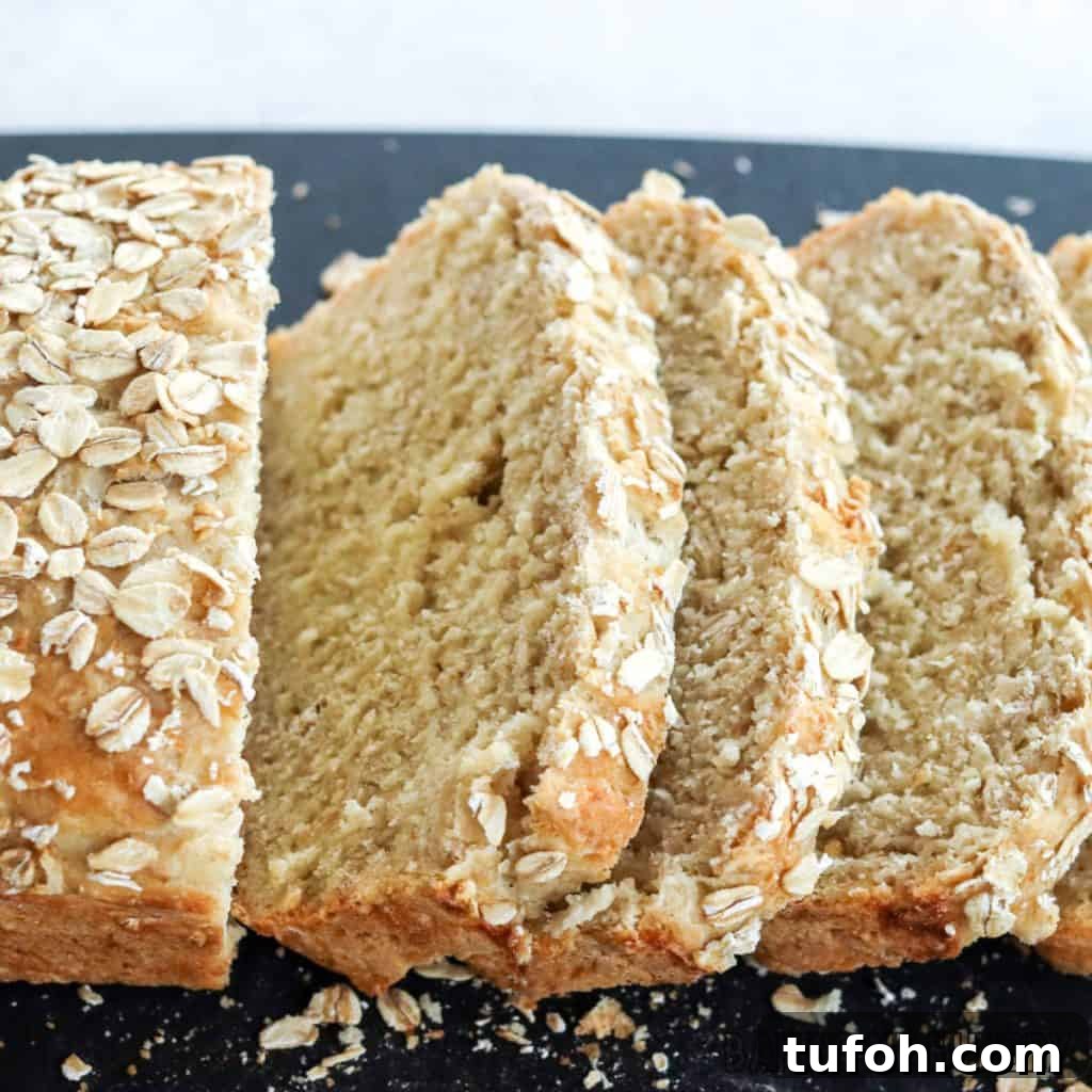 Homemade Oat Bread Recipe: Soft, Nutty Loaf You Can Bake at Home 14 sliced oatmeal bread on cutting board