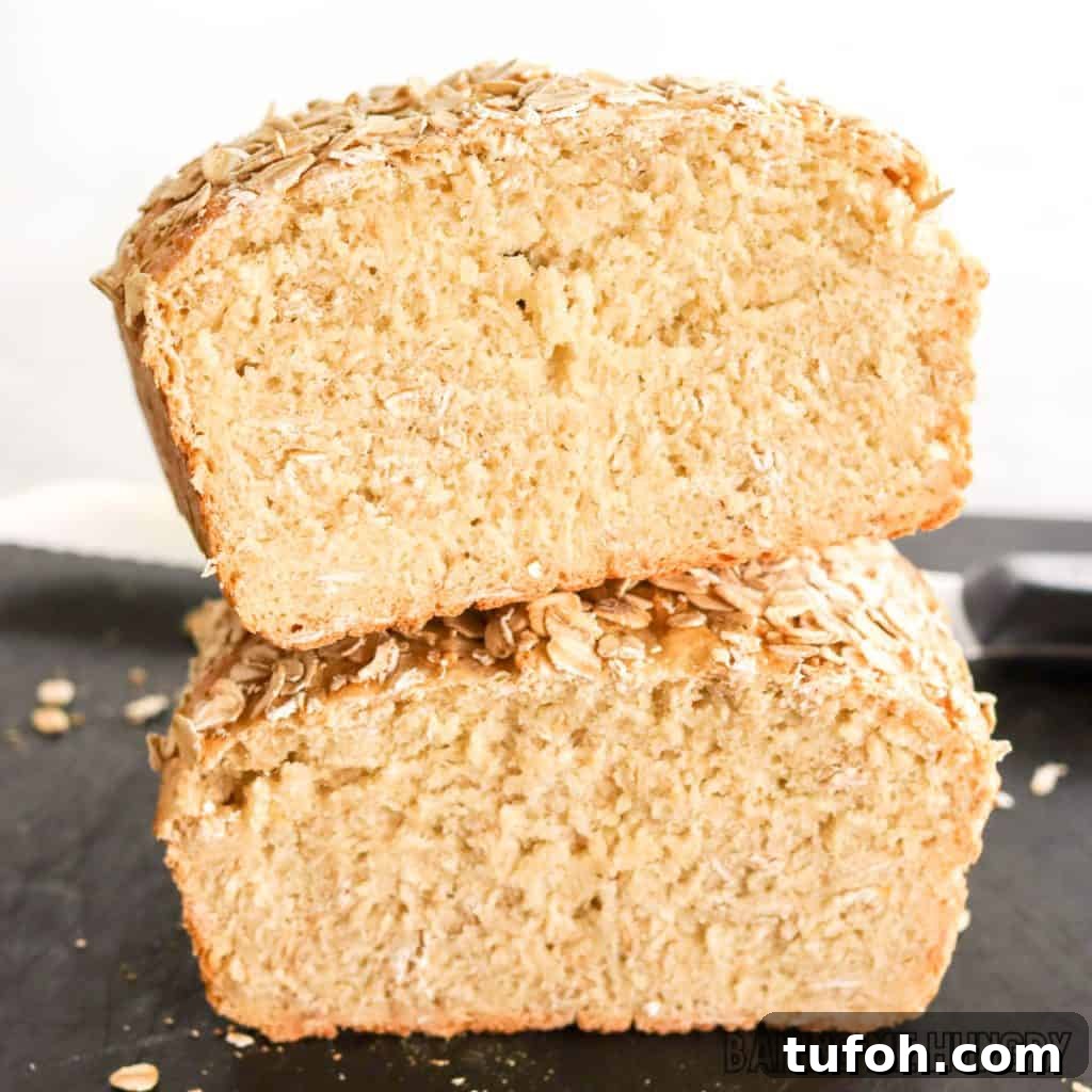 Homemade Oat Bread Recipe: Soft, Nutty Loaf You Can Bake at Home 3 oat bread recipe halved and stacked to show interior crumb