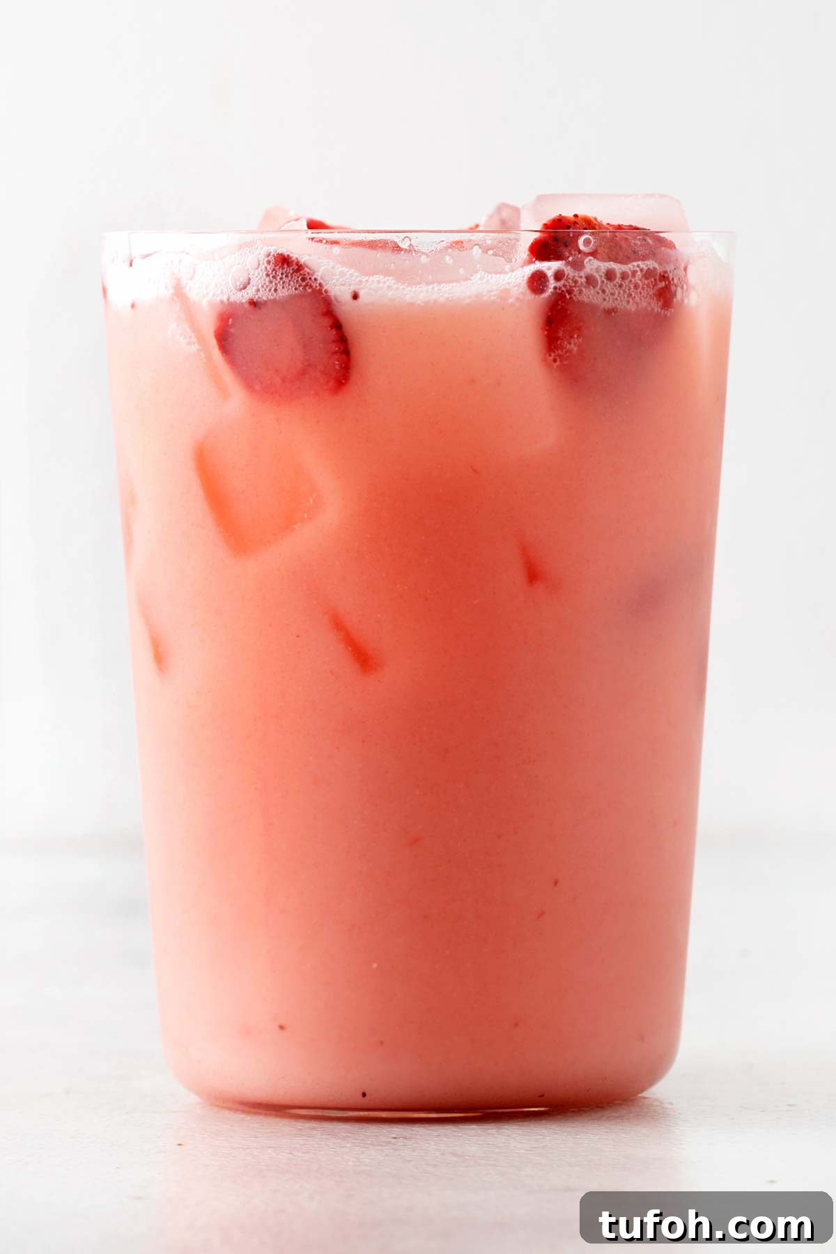 Starbucks Pink Drink in a glass cup.