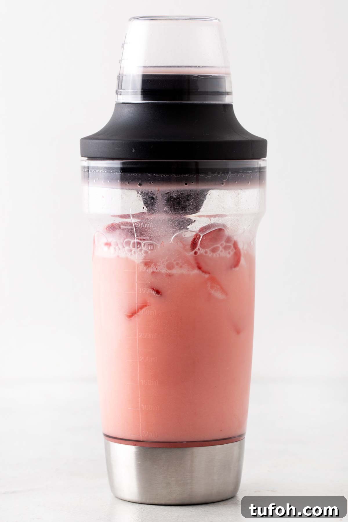 Pink Drink ingredients in a cocktail shaker.