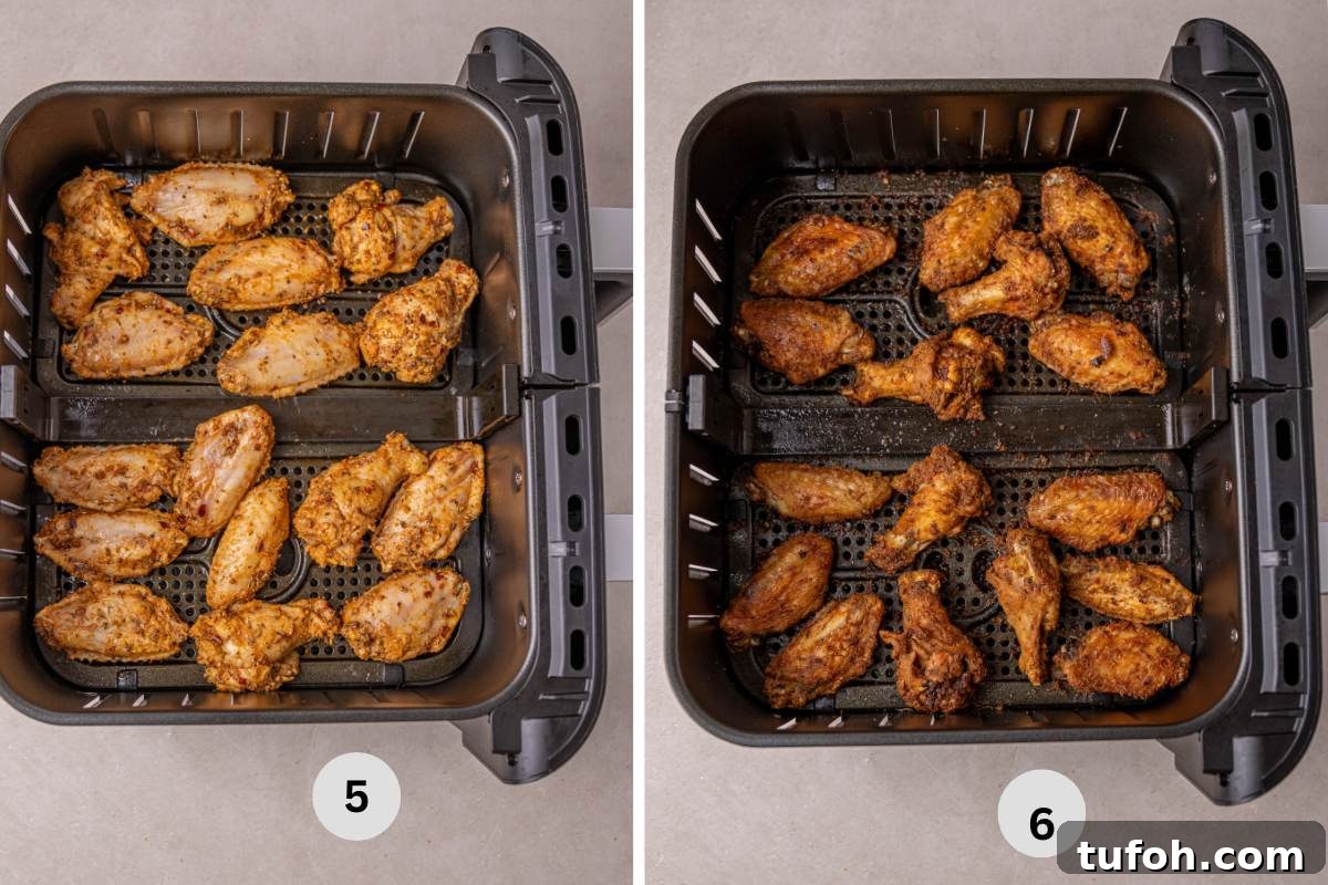 Air Fryer Frozen Chicken Wings (Cook Without Thawing) 7 Cooked wings in the air fryer browned and crispy.