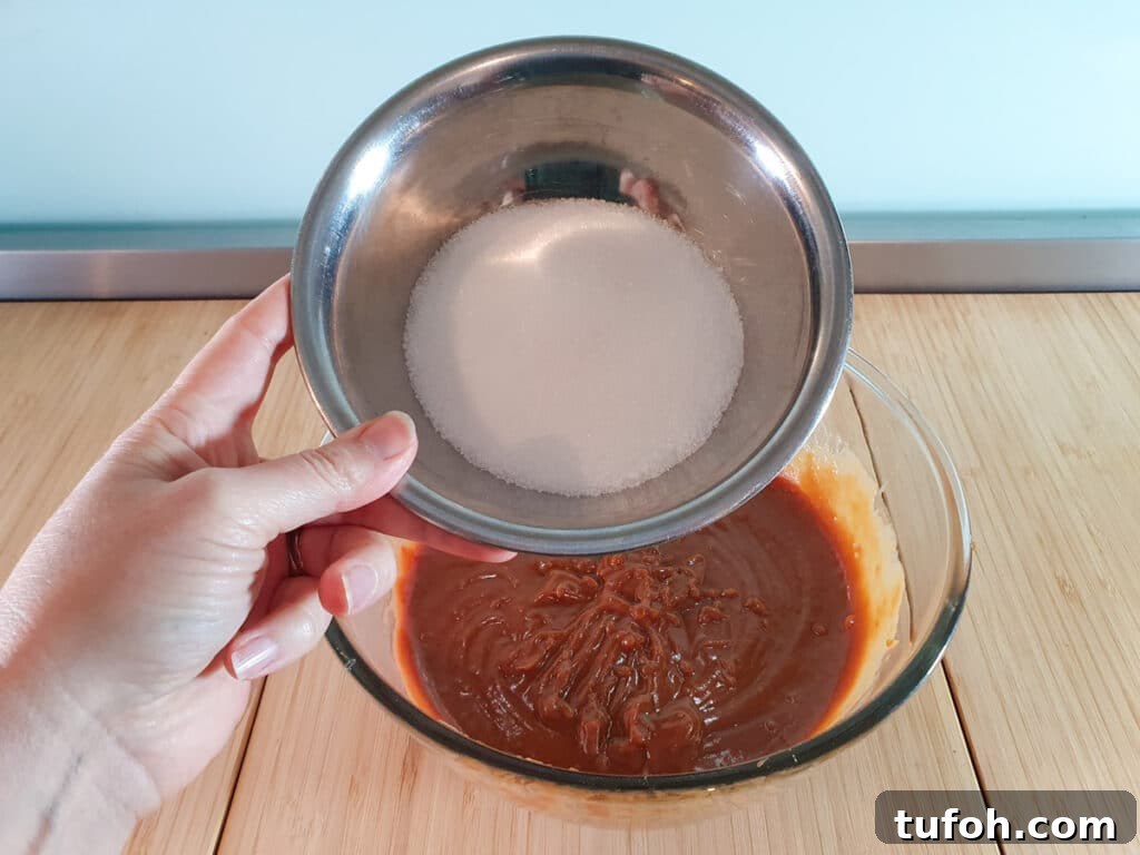 Decadent Egg-Free Brownies: Fudgy, Moist Recipe 9 Adding white sugar to brownie mix.