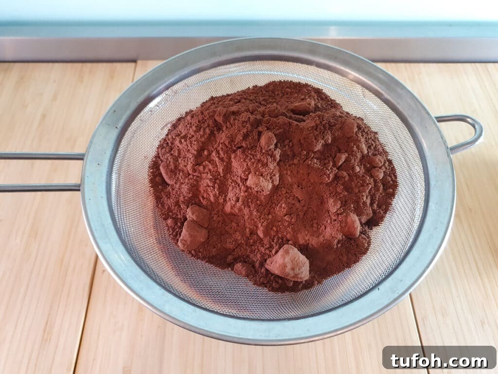 Decadent Egg-Free Brownies: Fudgy, Moist Recipe 11 Sifting flour, cocoa powder, salt and baking powder into brownie mix.