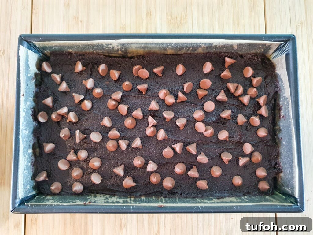 Decadent Egg-Free Brownies: Fudgy, Moist Recipe 13 Sprinkling on chocolate chips.