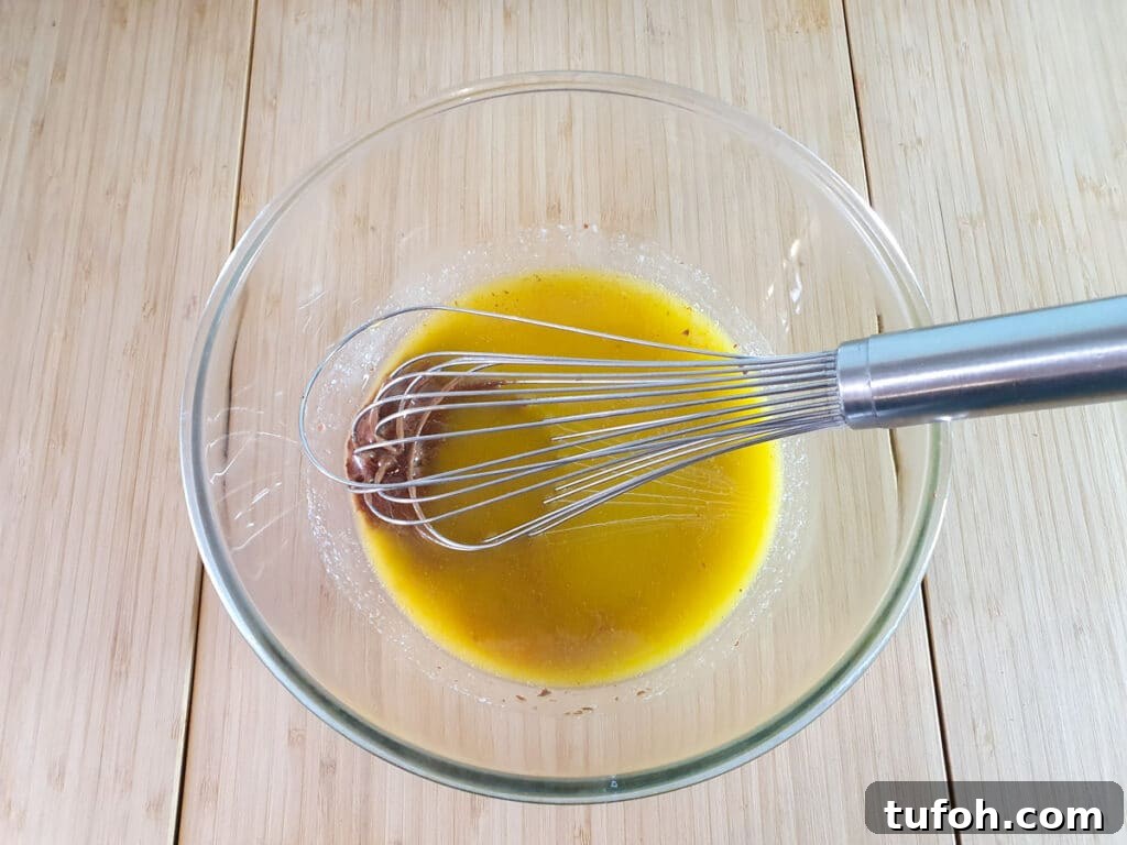 Decadent Egg-Free Brownies: Fudgy, Moist Recipe 8 Whisking melted butter and chocolate together.