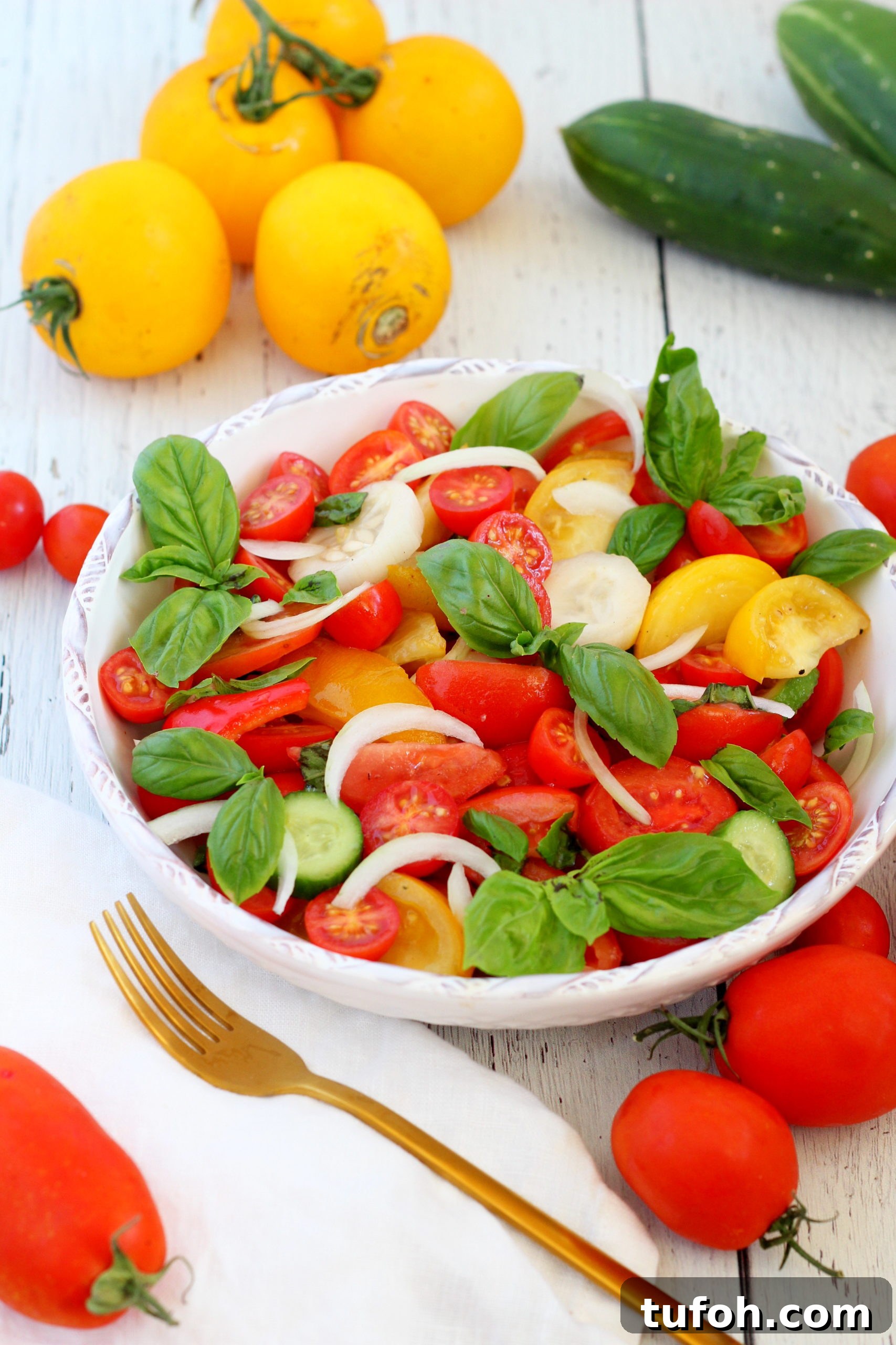Crisp Tomato & Cucumber Salad with Lemon Vinaigrette 7 tomato and cucumber salad in white bowl