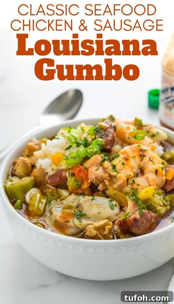 This easy, authentic louisiana gumbo recipe is loaded with seafood like shrimp and oysters, chicken and sausage. The deep golden roux recipe adds depth to this New Orleans classic. Cajun seasoning amplifies the flavors. #gumbo #cajun