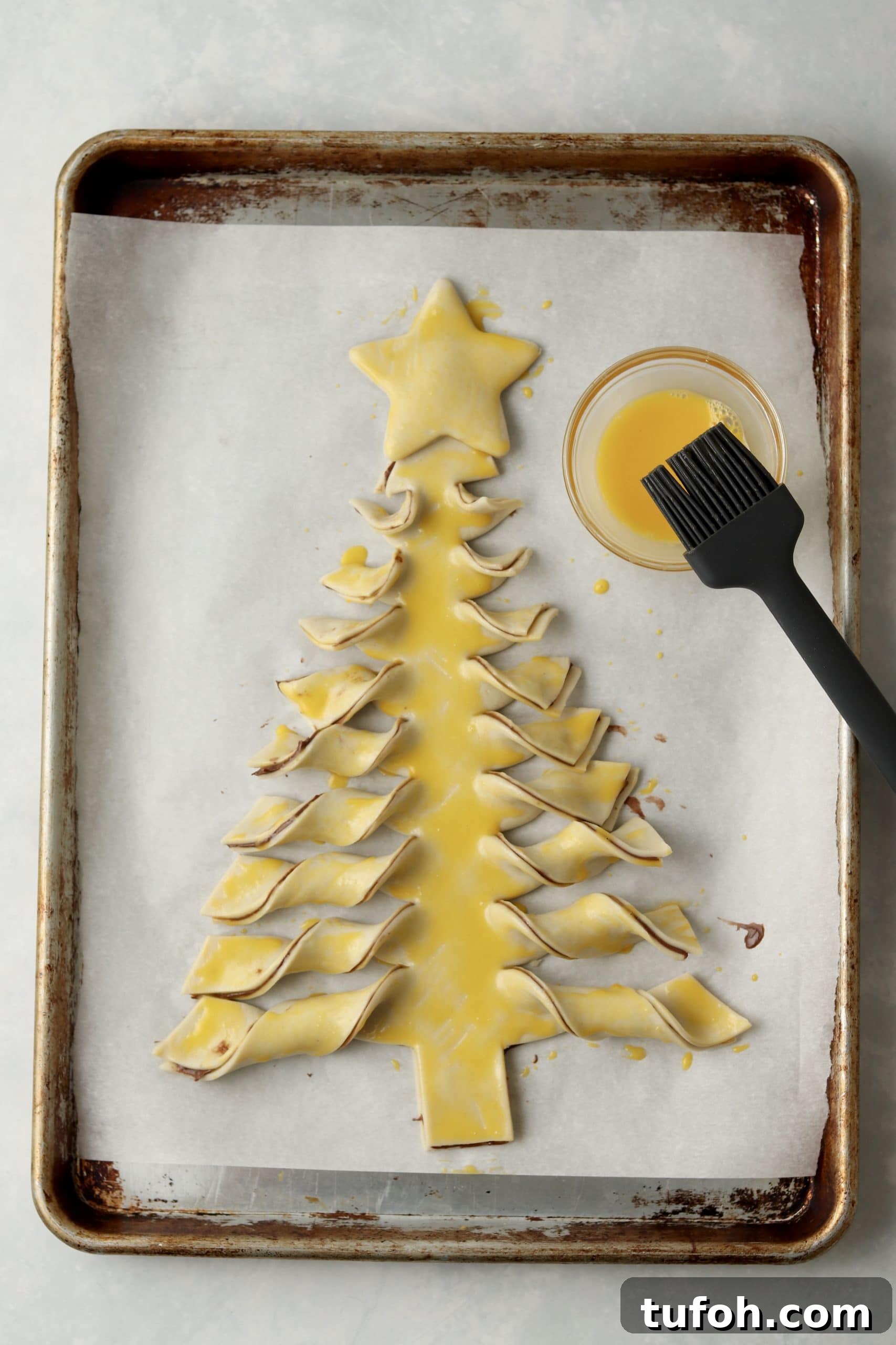brushed puff pastry xmas tree with egg wash.