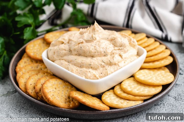 Creamy Homemade Ranch Dip Recipe for Parties and Snacks 2 Ranch dip in a square dish with crackers.