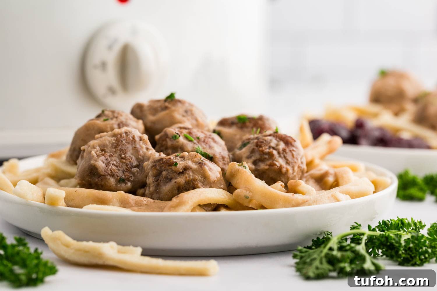 Swedish Meatballs in Slow Cooker with Creamy Sauce 7 Slow Cooker Swedish Meatballs served on plate