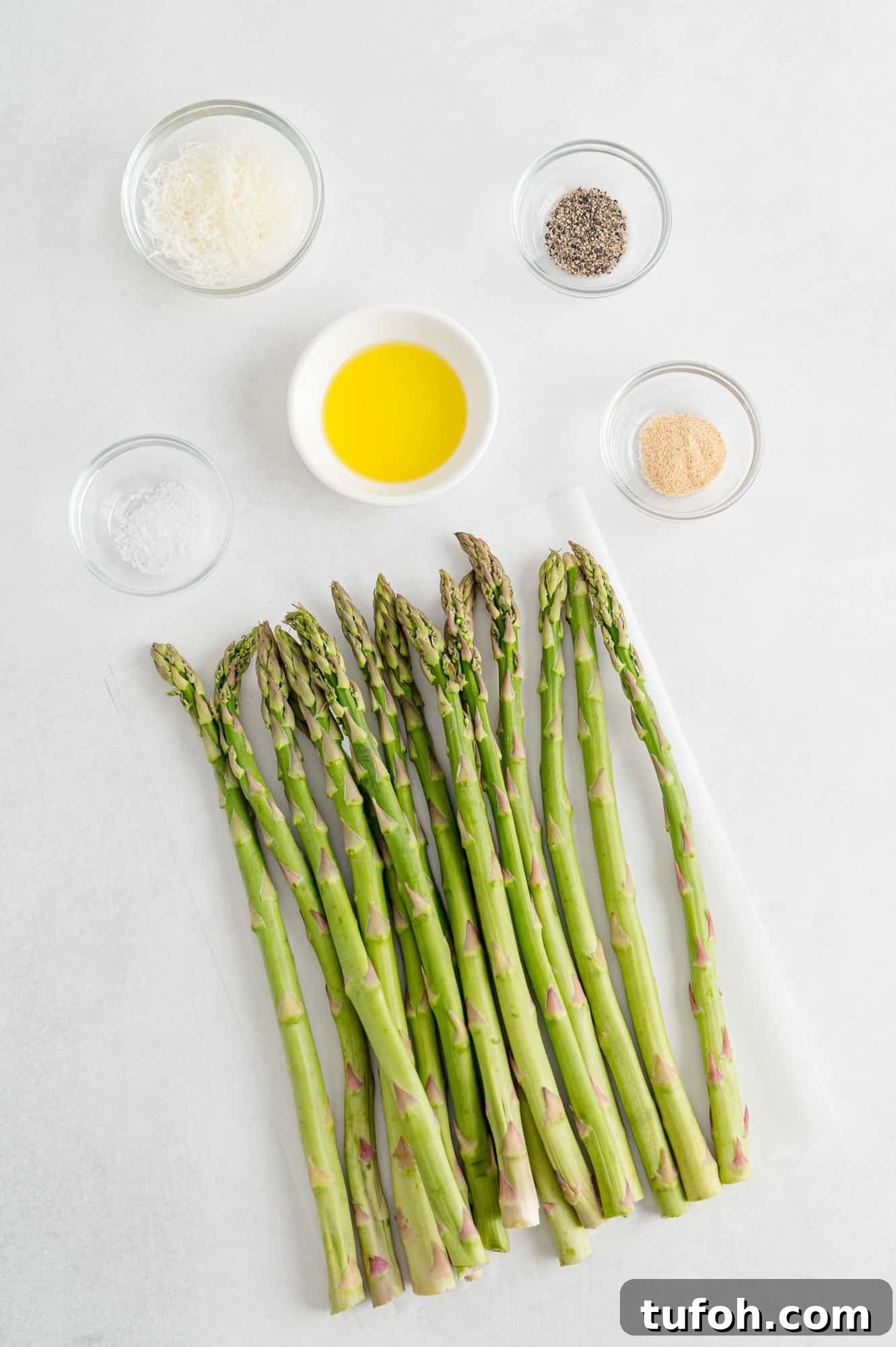 Crispy Air Fryer Asparagus in Minutes 4 Ingredients needed for recipe including fresh asparagus.