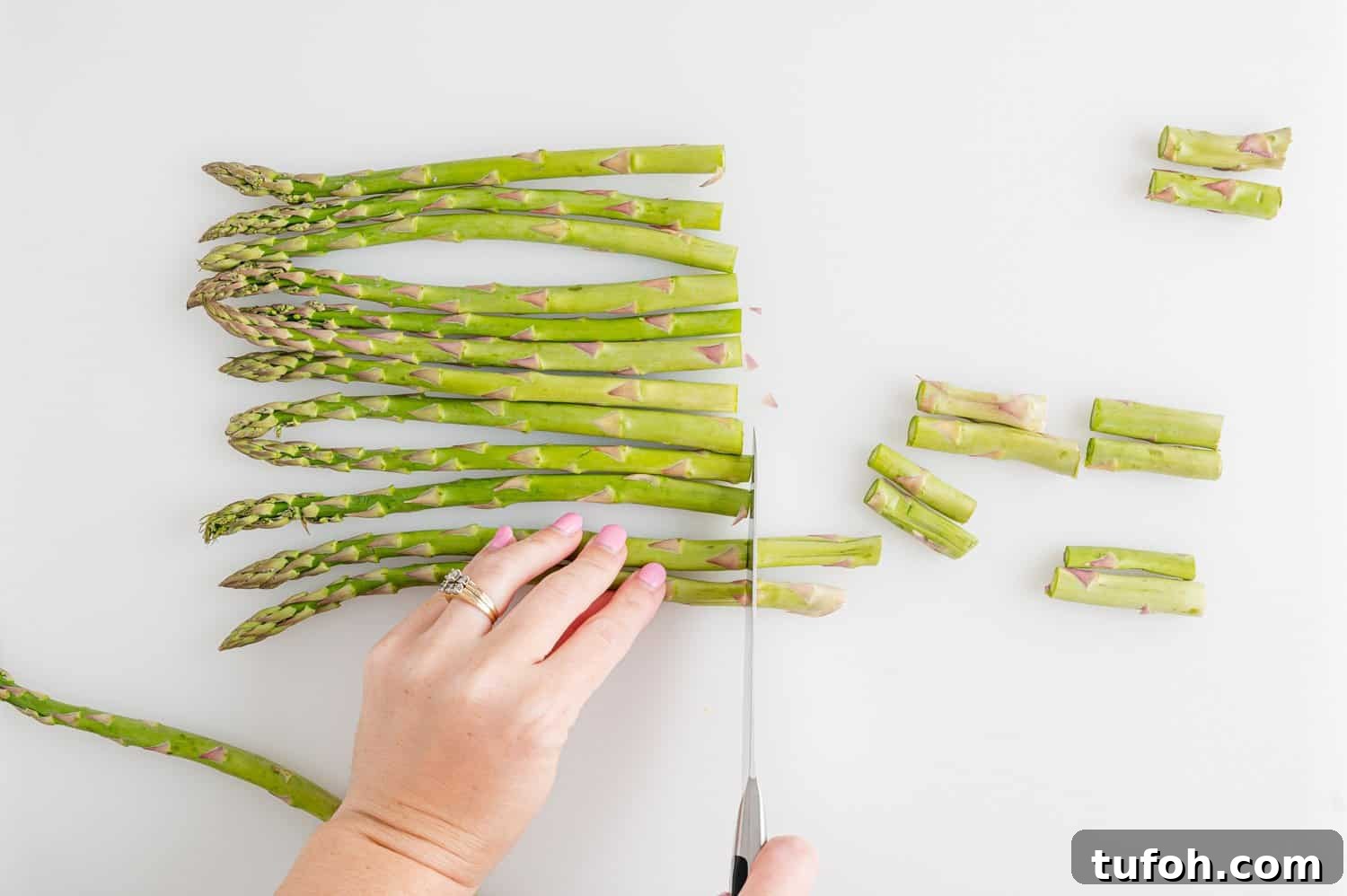 Crispy Air Fryer Asparagus in Minutes 6 Asparagus being cut.