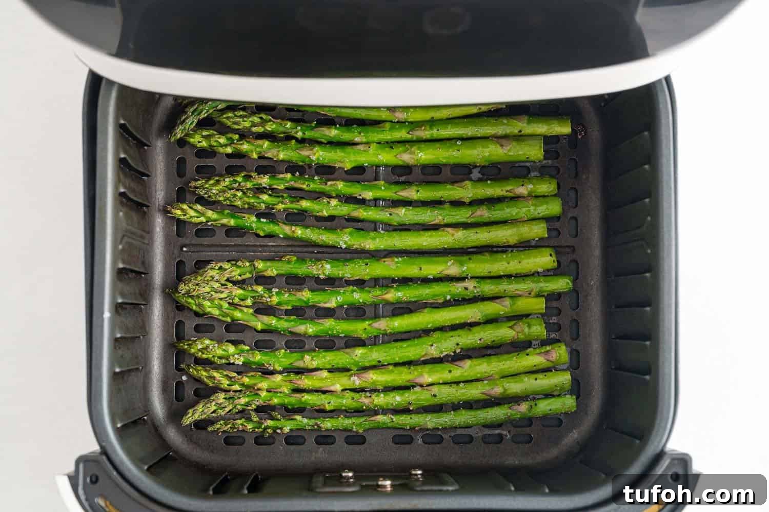 Crispy Air Fryer Asparagus in Minutes 9 Cooked asparagus in air fryer.
