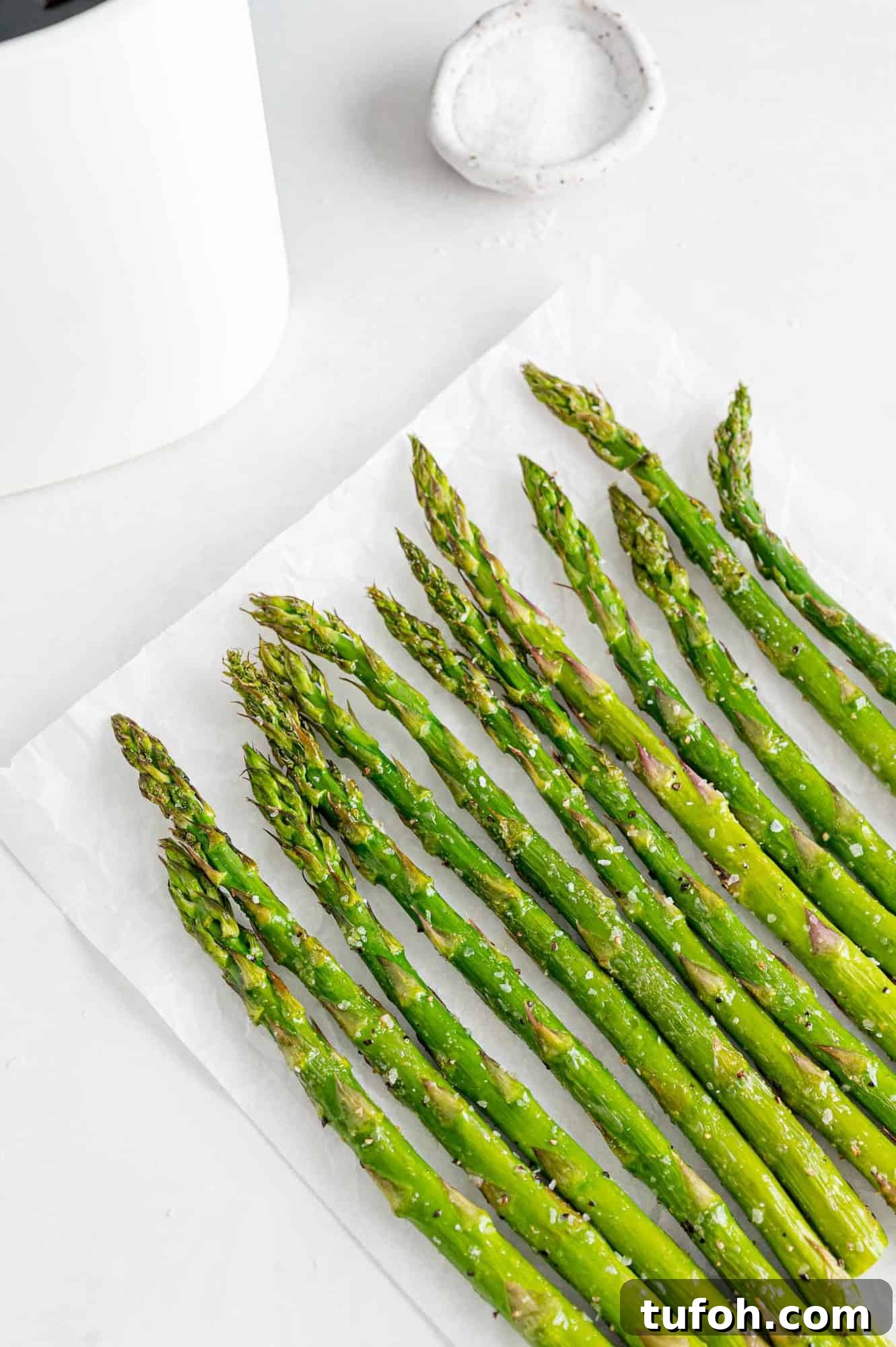 Crispy Air Fryer Asparagus in Minutes 10 Air fryer asparagus diagonal from bottom right corner.