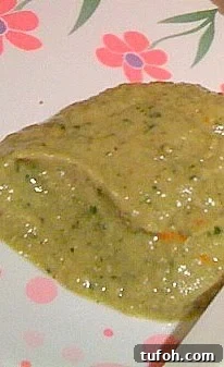 Cilantro Garlic Hummus Recipe — Fresh, Creamy & Flavorful 3 Cilantro garlic hummus on a white and pink patterned plate