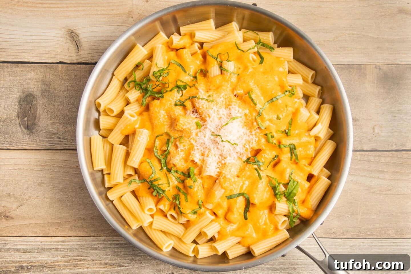 Creamy Tomato and Cottage Cheese Pasta Sauce Recipe 11 This is a picture of the cooked pasta with some sauce, parmesan and basil.