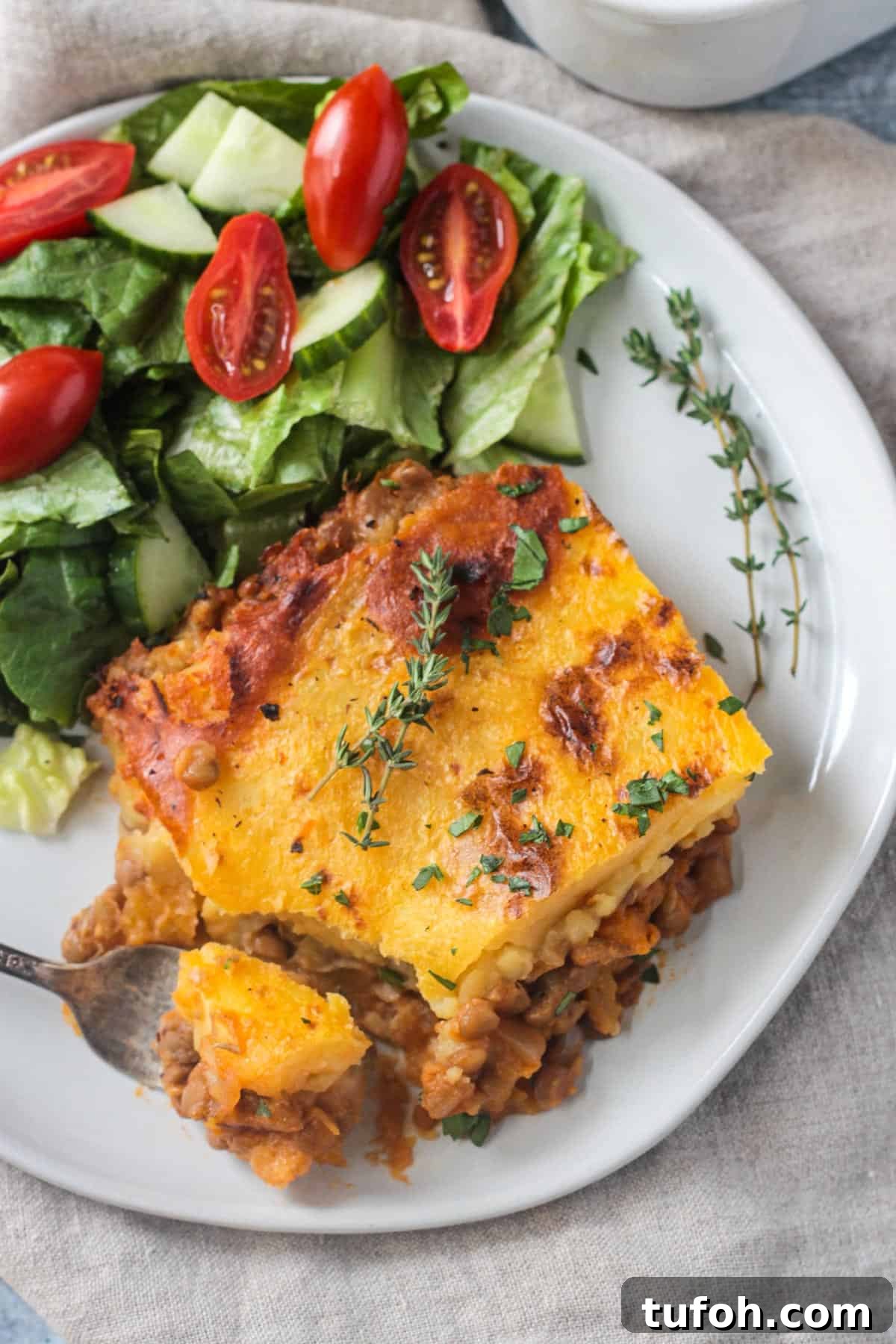 Bite of shepherd's pie on a fork.