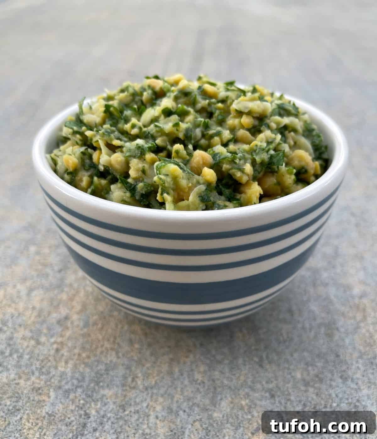 Gluten-Free Low-Carb Chickpea Tabbouleh Recipe 6 Chickpea tabbouleh in blue striped bowl.